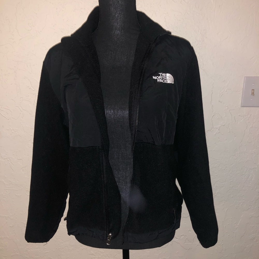 Woman’s black North Face jacket
